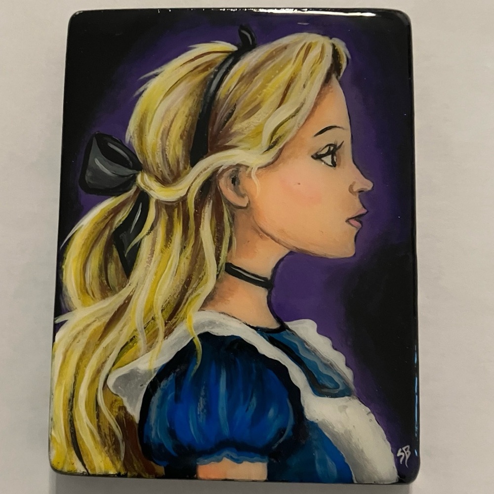 Alice in Wonderland painting on a cut Santorini